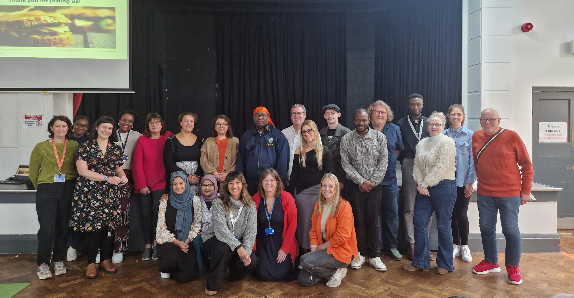 A group of people posing and smiling for a photo