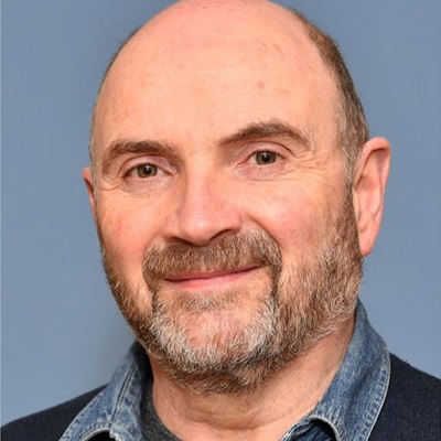 Photograph of Steve Crump, softly smiling at the camera
